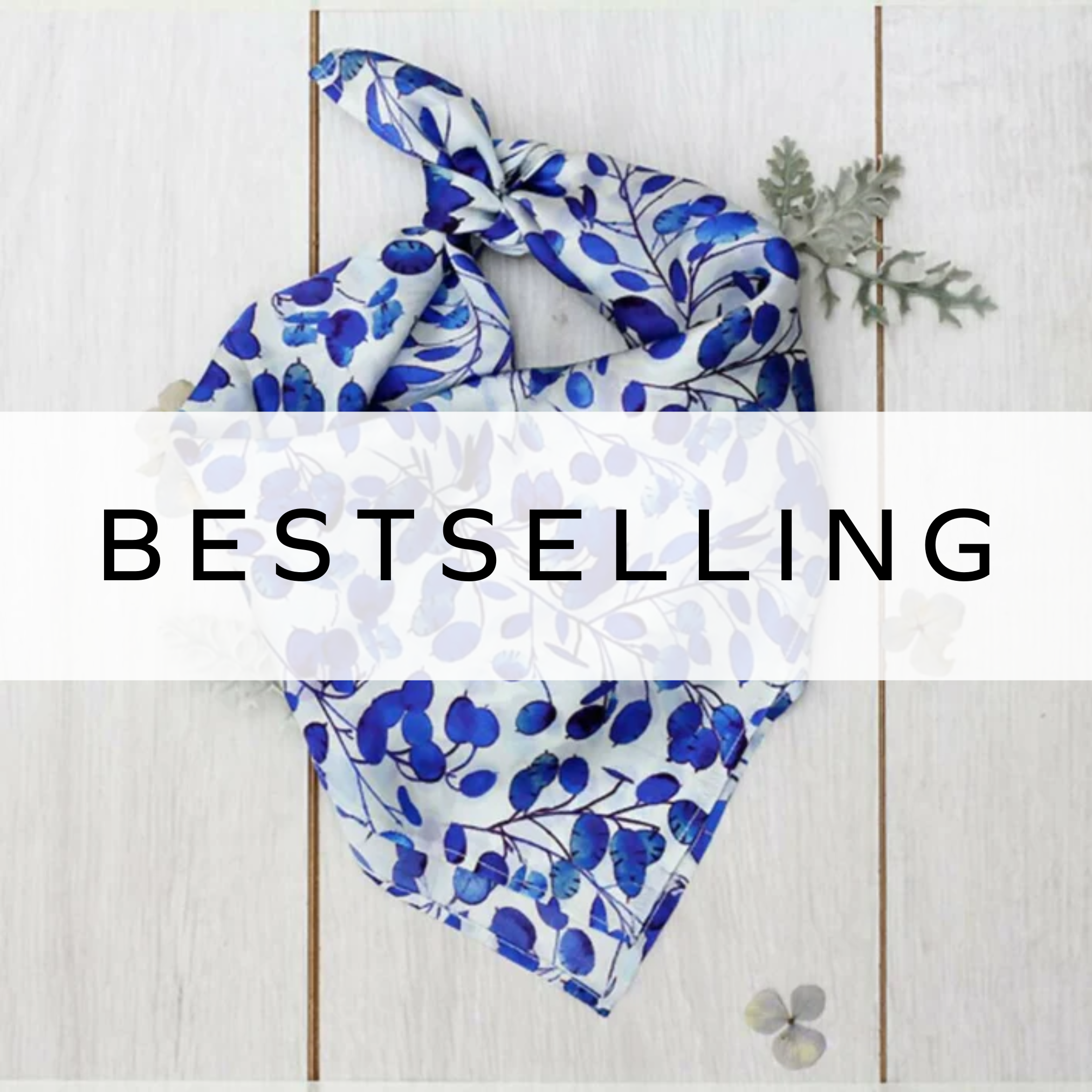 A delicate white and blue flower bud scarf, perfect for wearing as a headscarf, adding a soft, floral touch to any outfit with its elegant design.