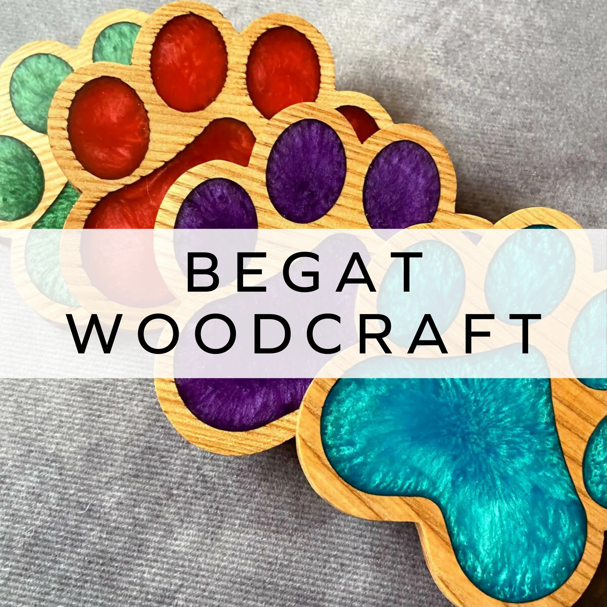 Wooden coasters shaped like dog paws, featuring vibrant resin-filled details.