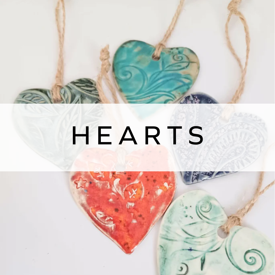Hanging heart decoration in various colors, handcrafted ceramic ornament.