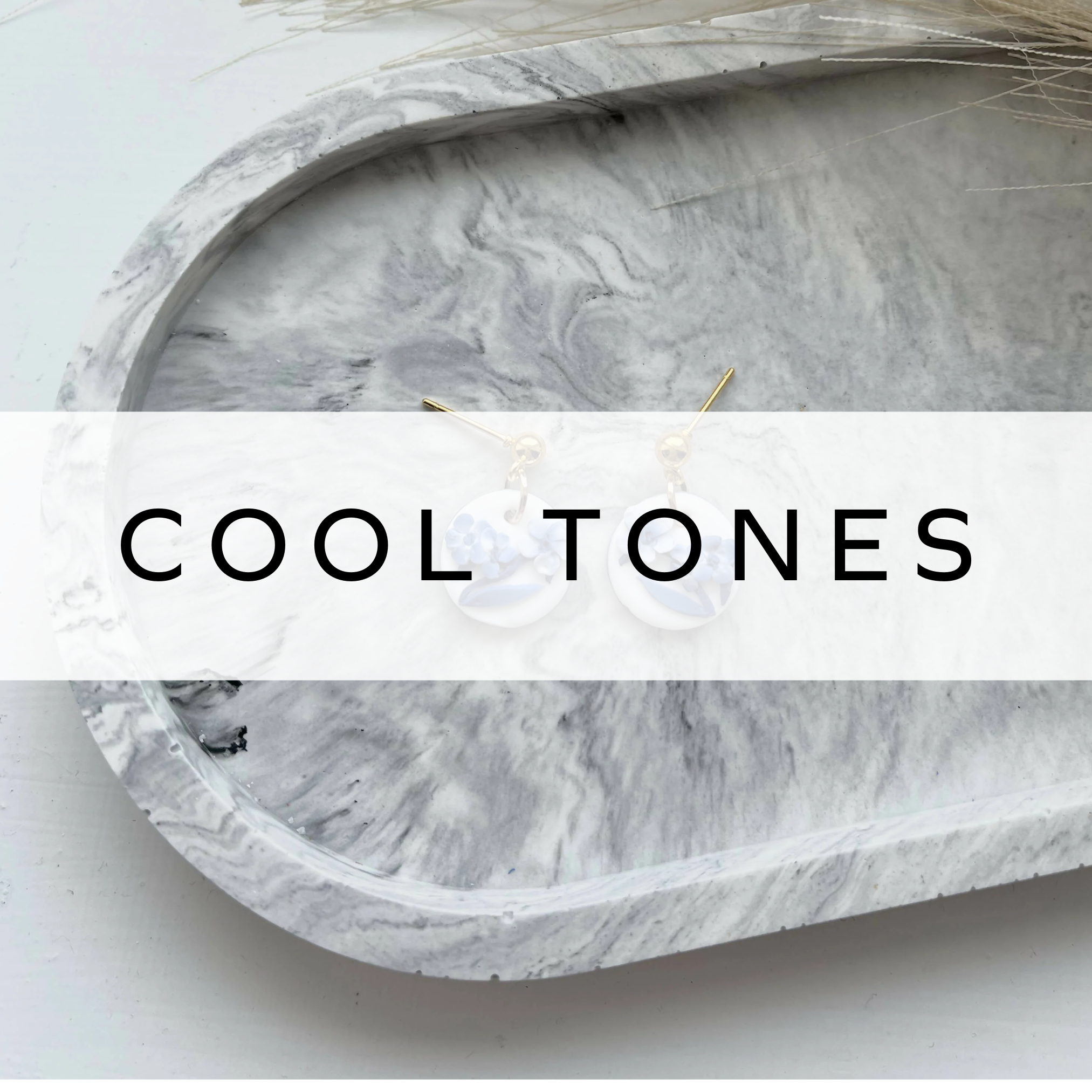 Blue and white earrings with a modern, elegant design – stylish and eye-catching accessory.