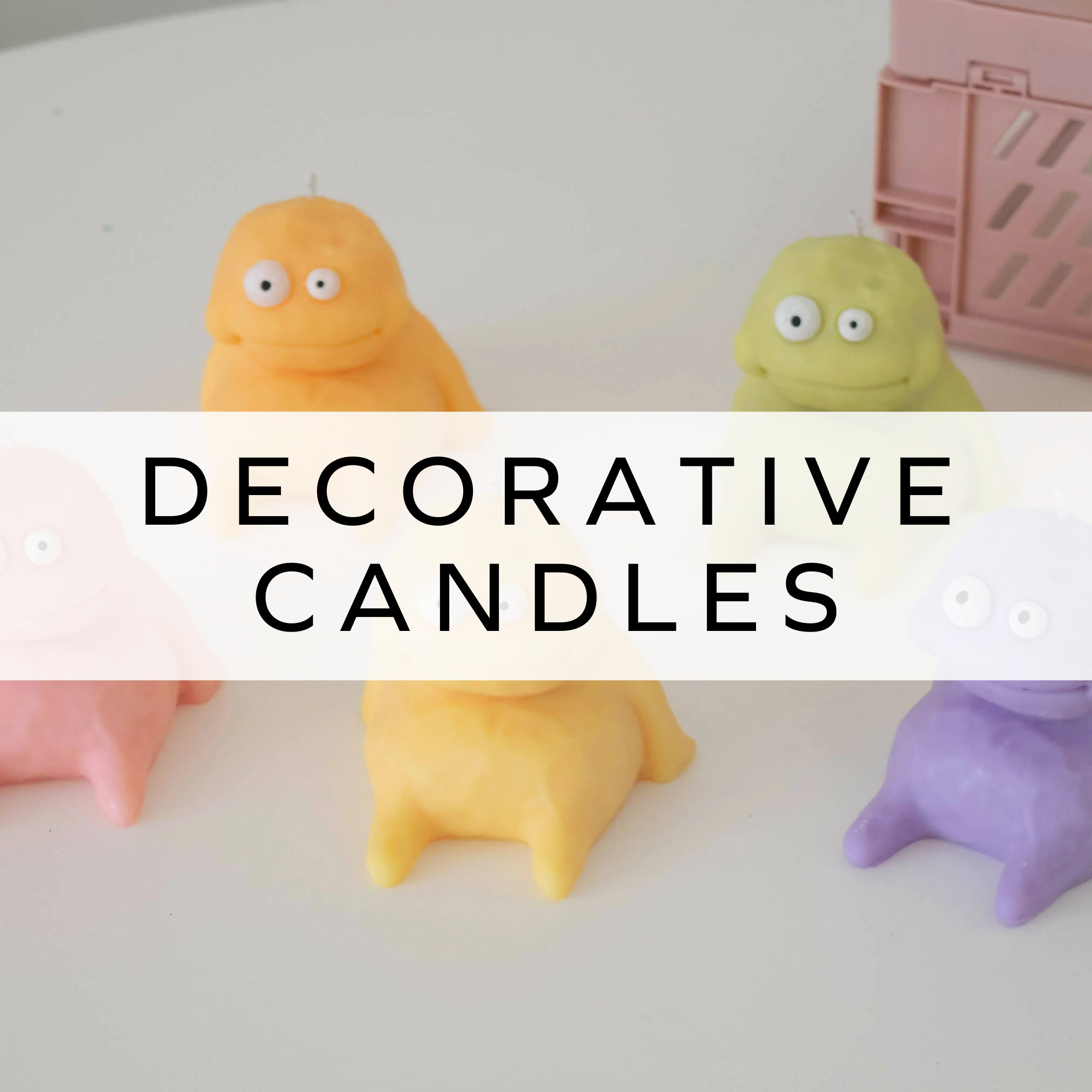 Multicoloured blob monster candles, quirky and fun, perfect for home décor.