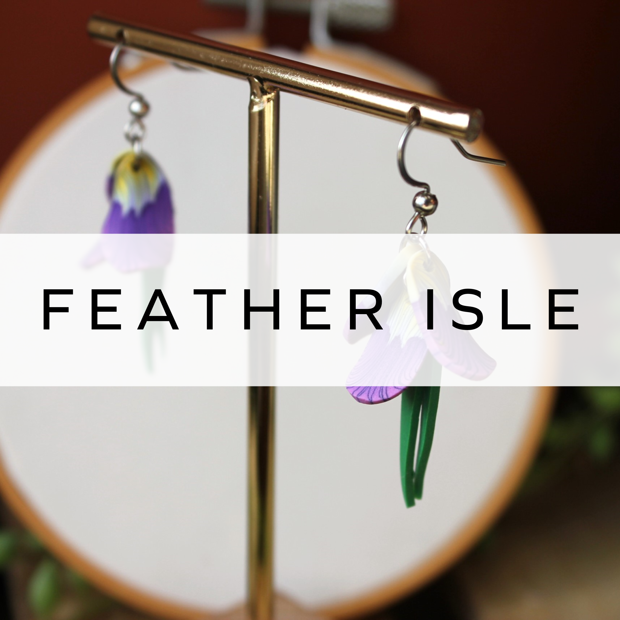 Handcrafted drop earrings designed as delicate violet flower petals with leaves, featuring intricate details and a nature-inspired, elegant design.