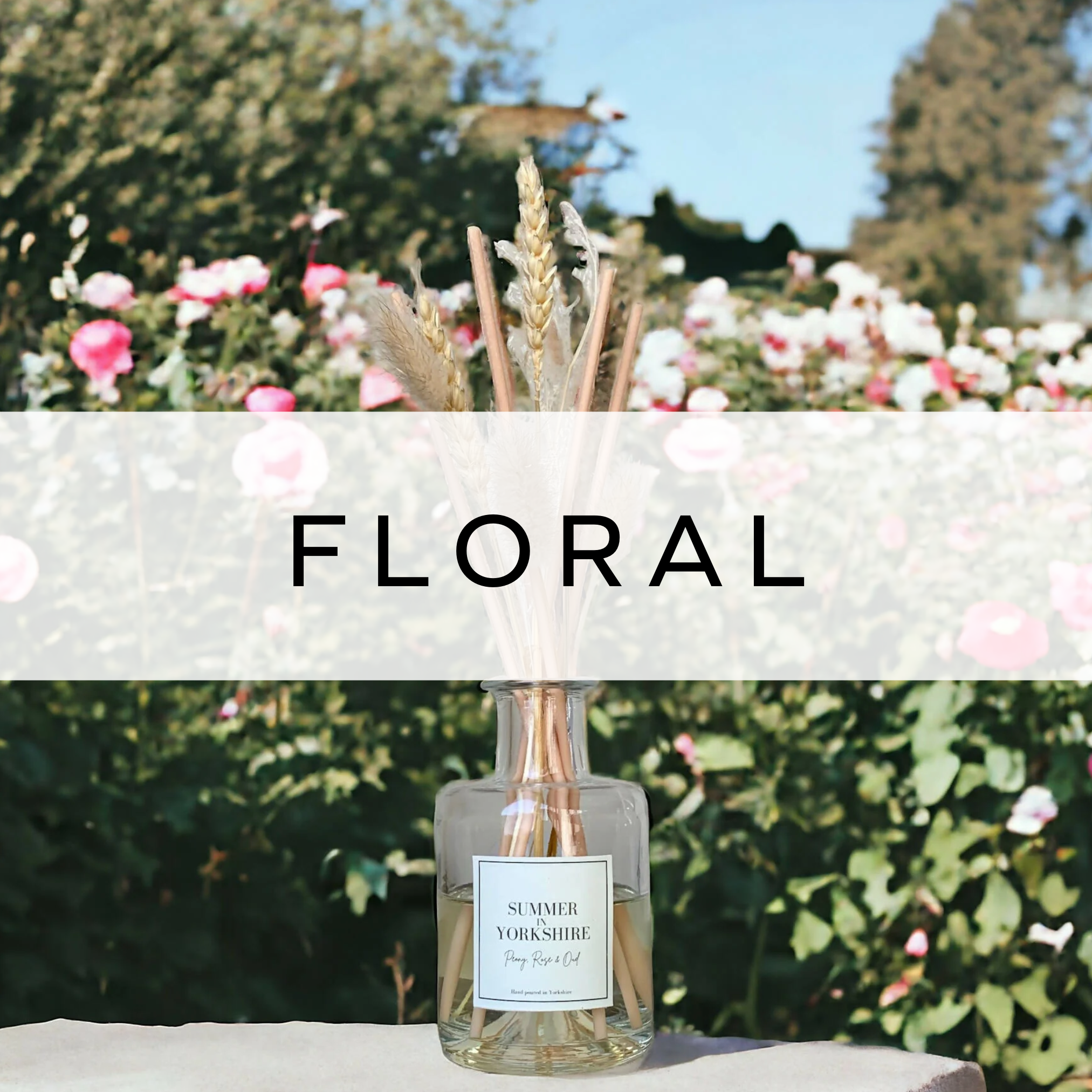 Elegant reed diffuser with natural reeds, releasing a floral fragrance, set against a backdrop of delicate flowers