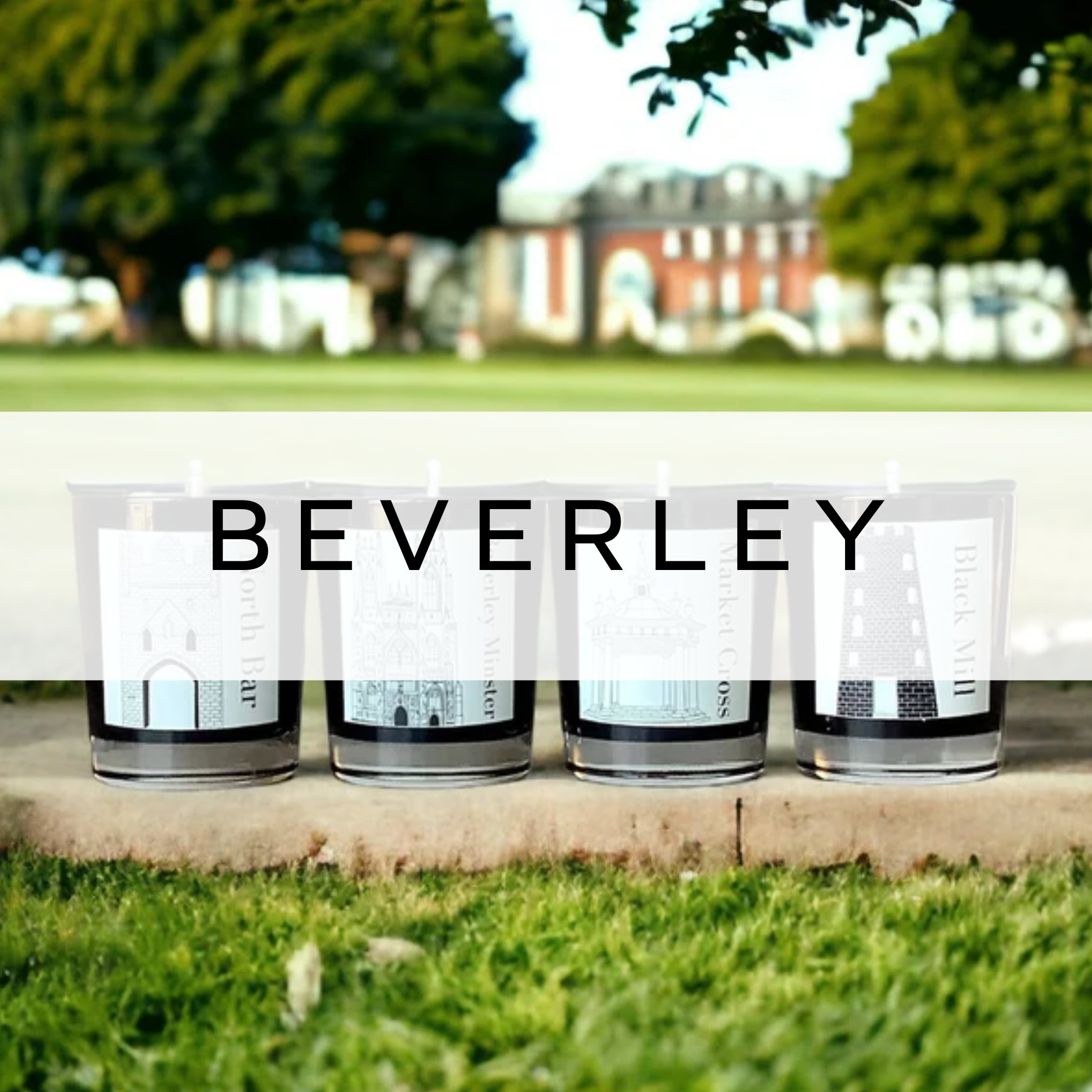 Four Beverley-themed candles displayed on the Westwood, showcasing their unique designs and scents, with the scenic landscape of Beverley in the background.