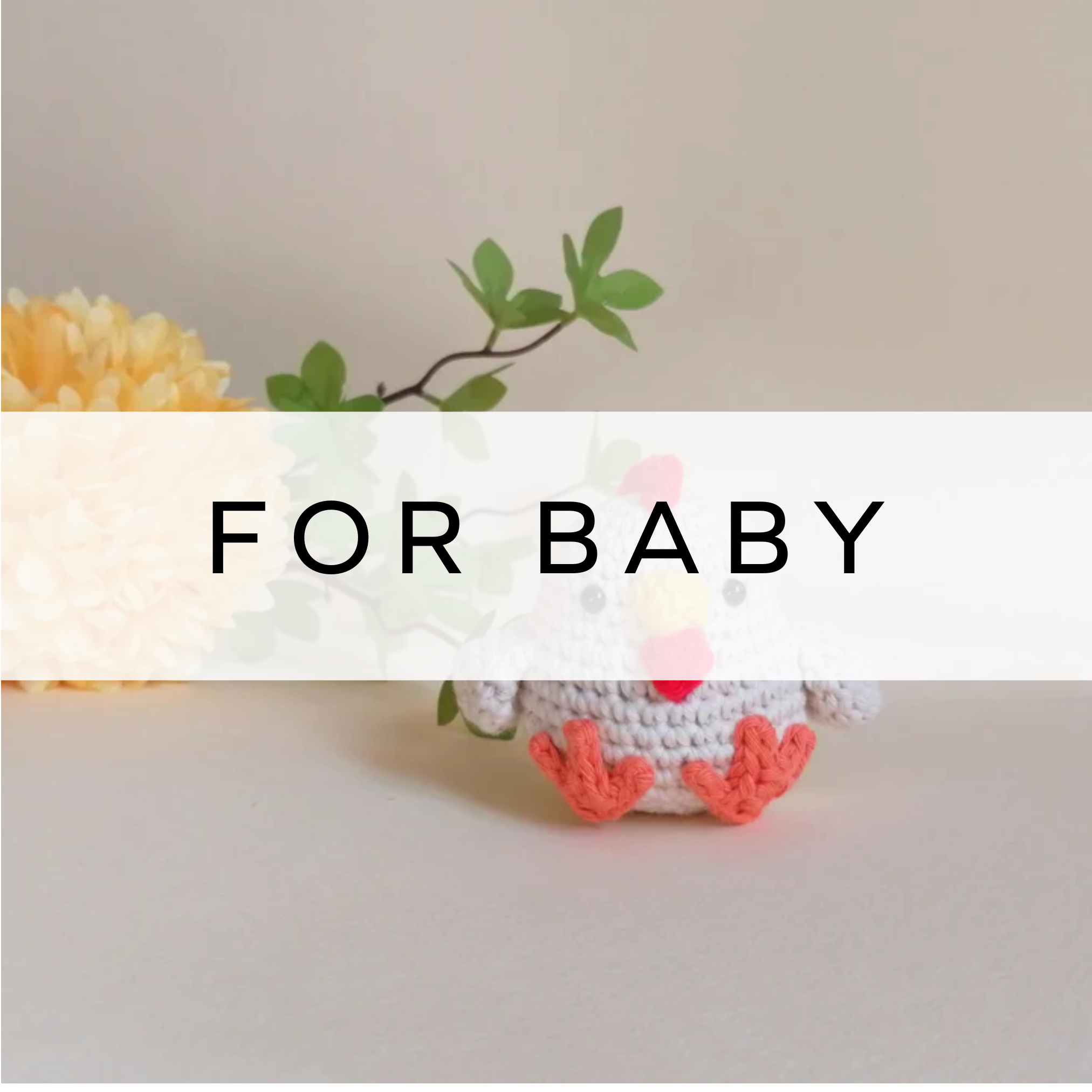 A cute knitted chicken toy with white and orange yarn, perfect for cuddling or as a charming addition to a child's toy collection or nursery decor.