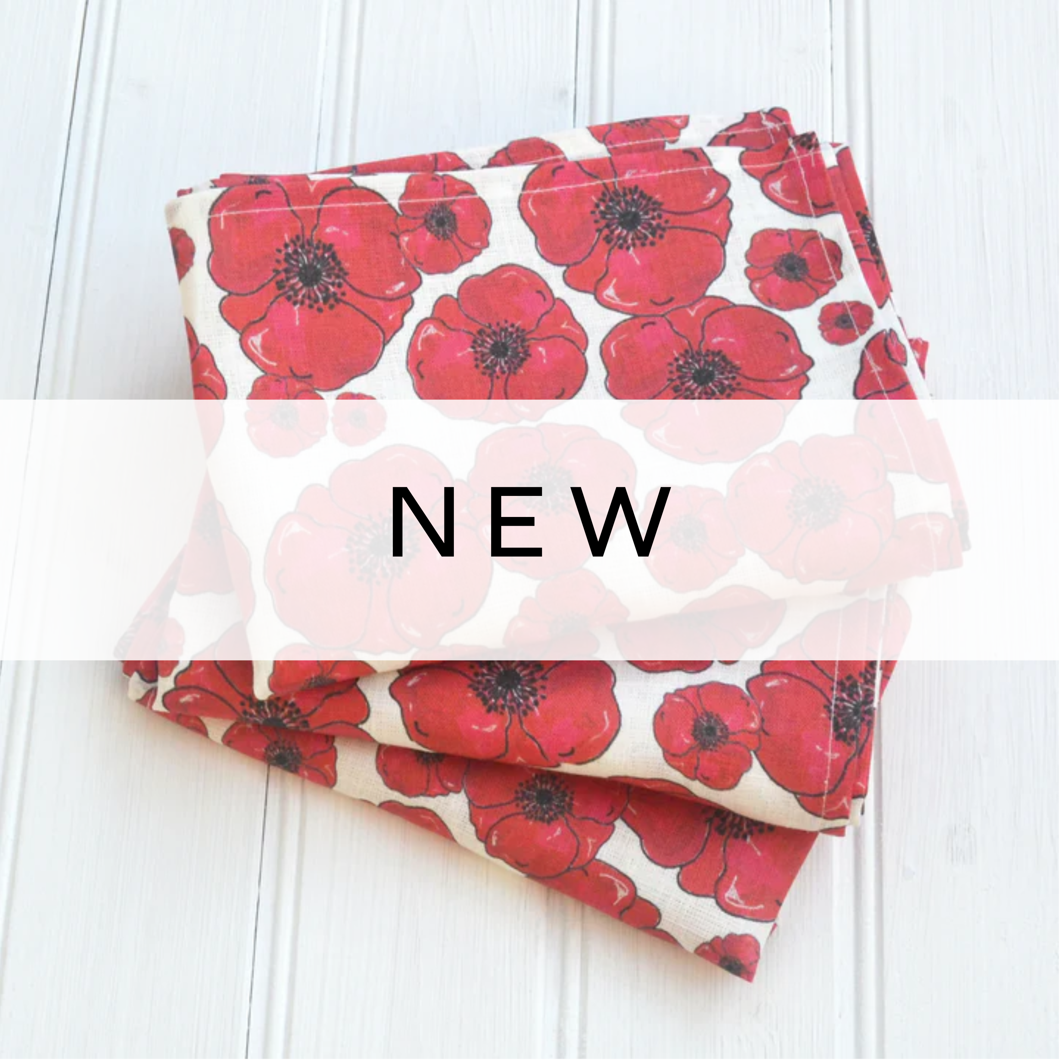 Tea towels featuring bold red poppy designs, perfect for a bright, floral kitchen touch.