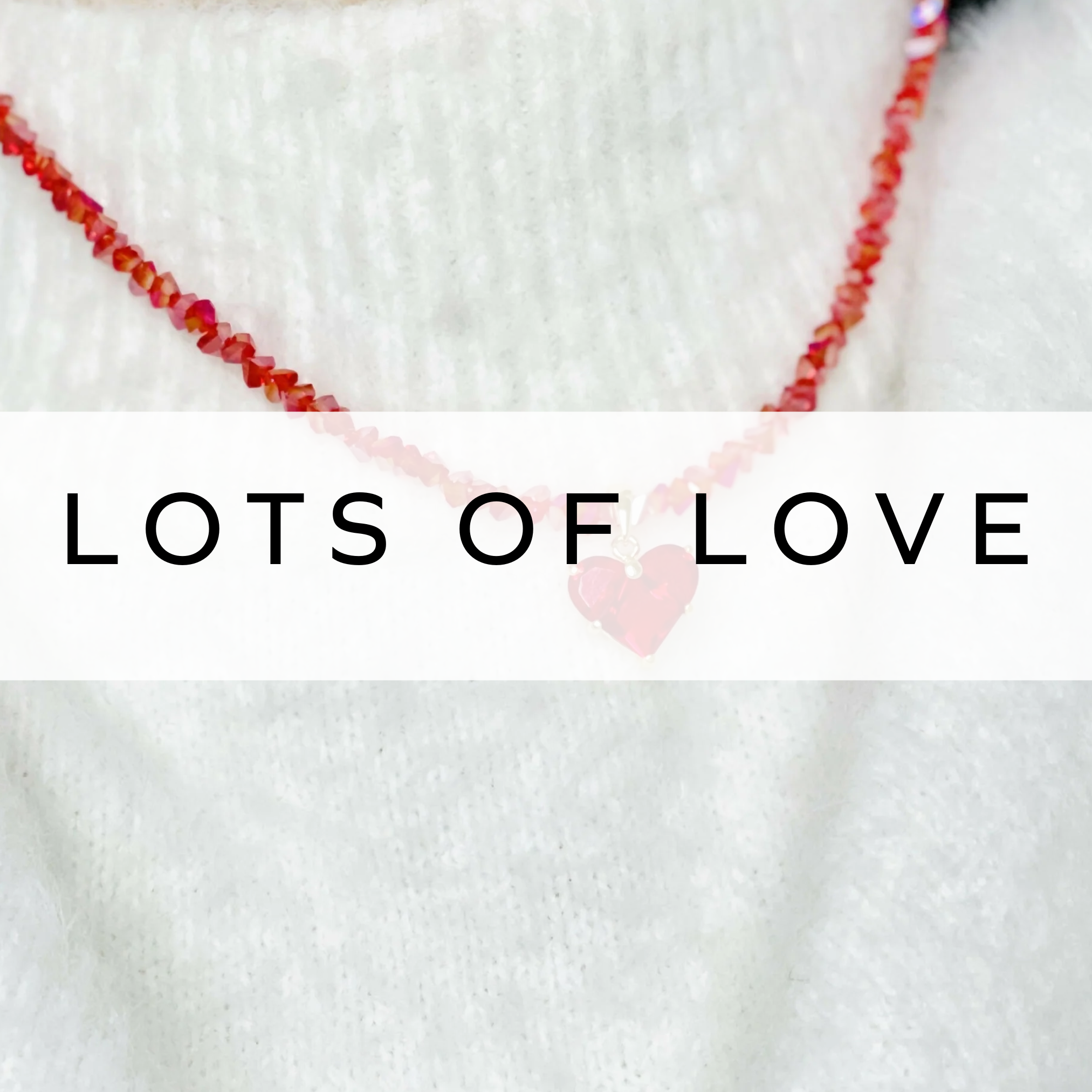 A stunning red crystal necklace featuring a delicate heart pendant, perfect for adding a touch of romance and elegance to any outfit.