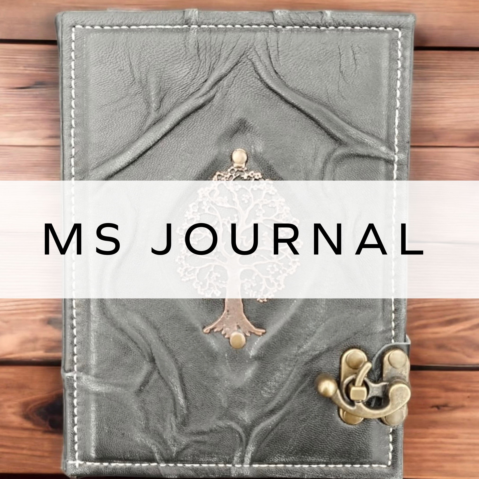 Leather journal with tree on it.