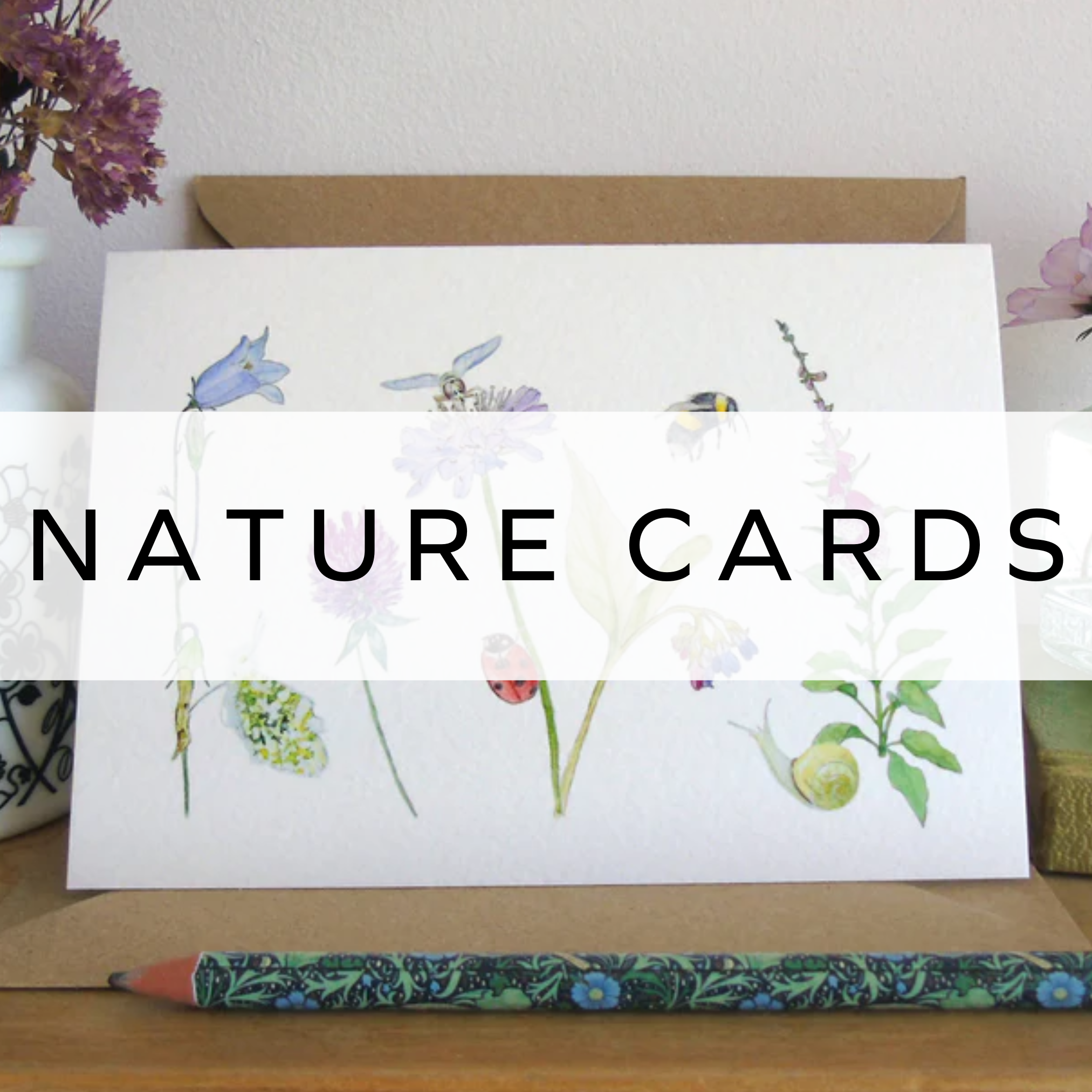 Greeting card featuring delicate flowers and illustrated garden bugs, inspired by nature.