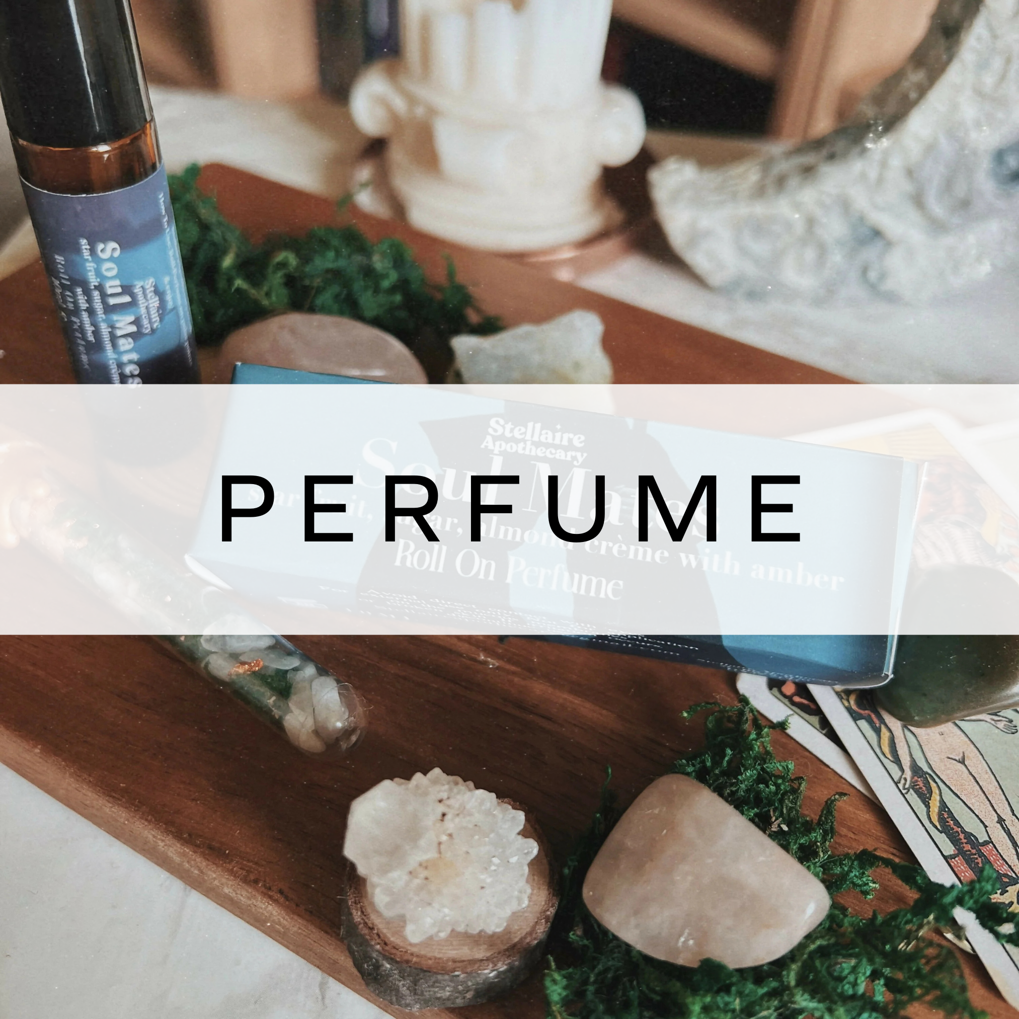 Perfume and box displayed on wooden board.