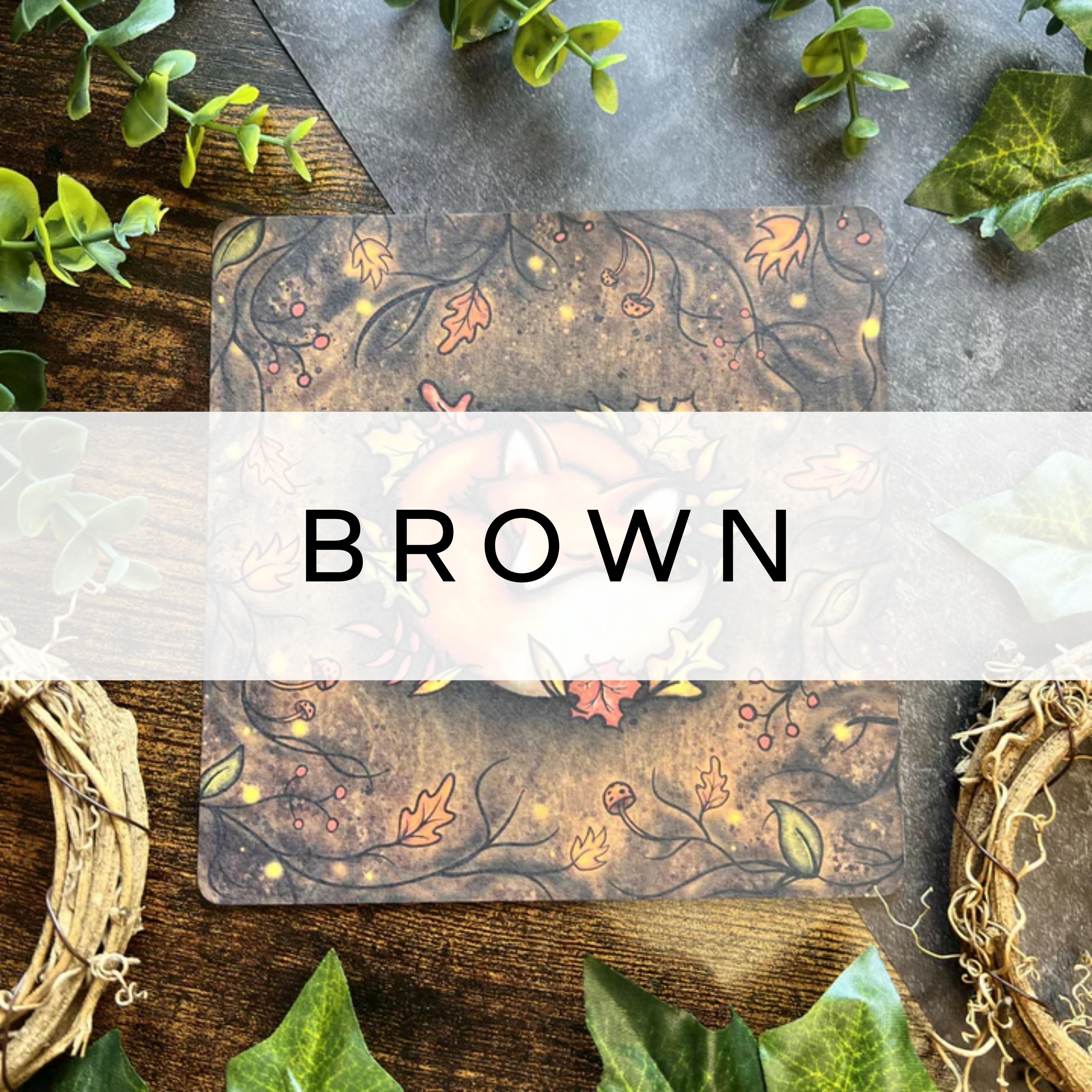 Illustration of a fox sleeping in a bed of leaves with a brown background.