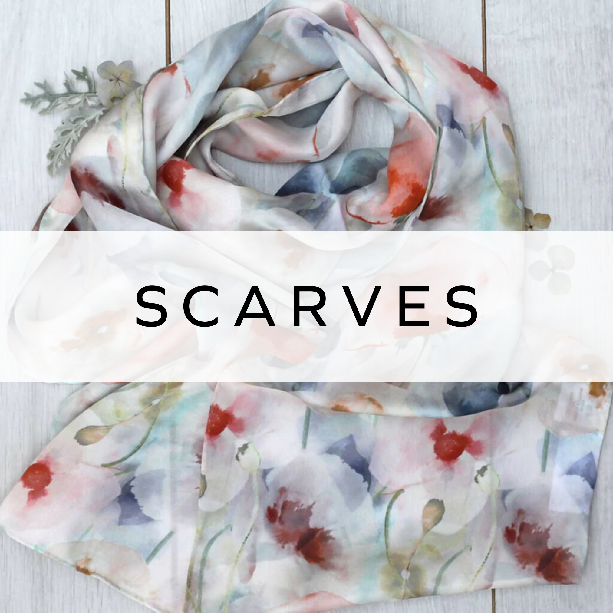 White silk scarf featuring a vibrant, colourful pattern, perfect for adding a touch of elegance and personality to any outfit.