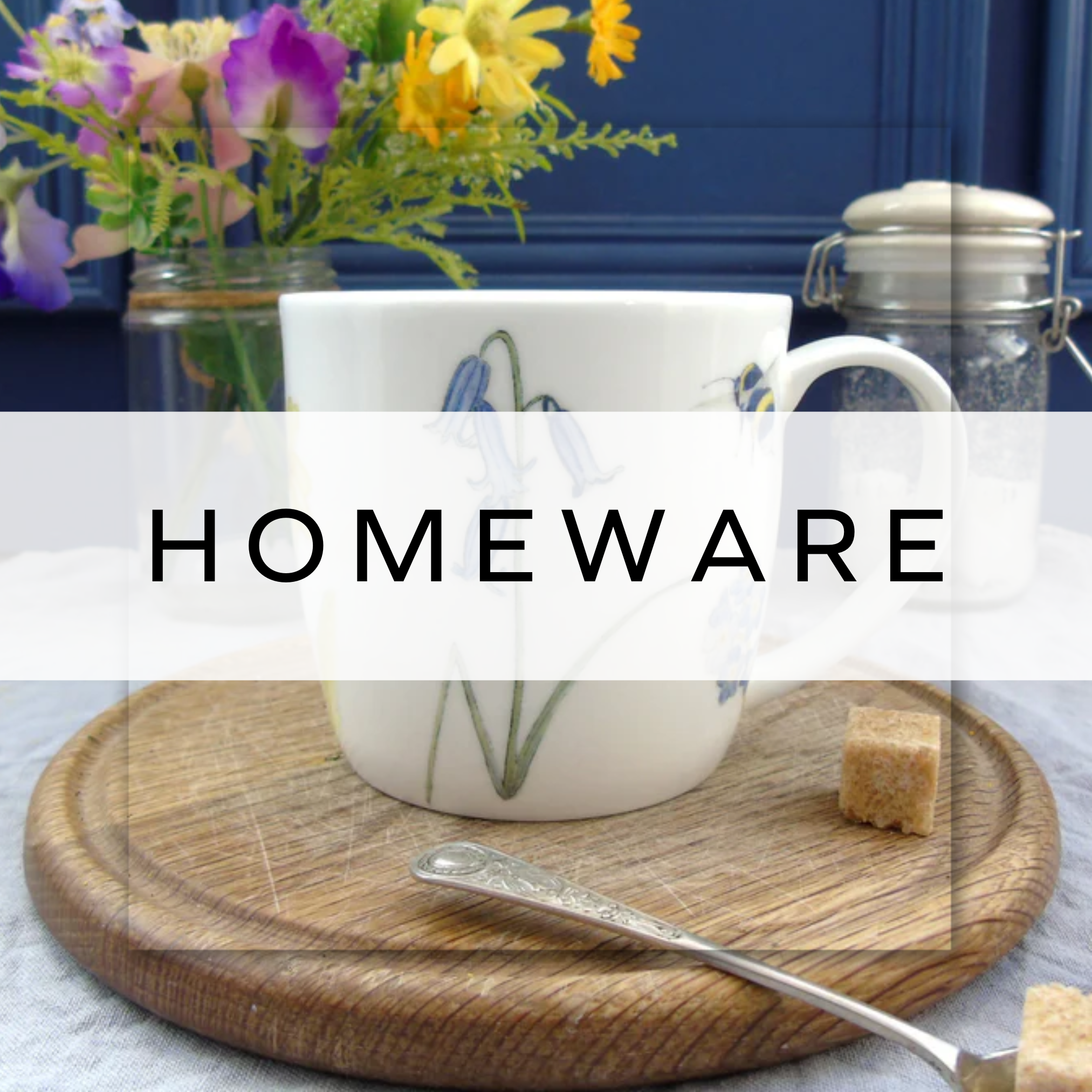 A white mug with dainty bluebell design on.
