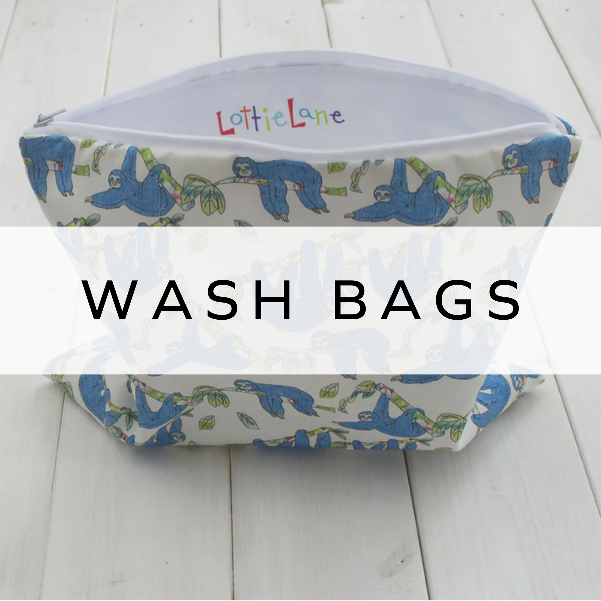 White washbag featuring a playful blue sloth print hanging from branches.