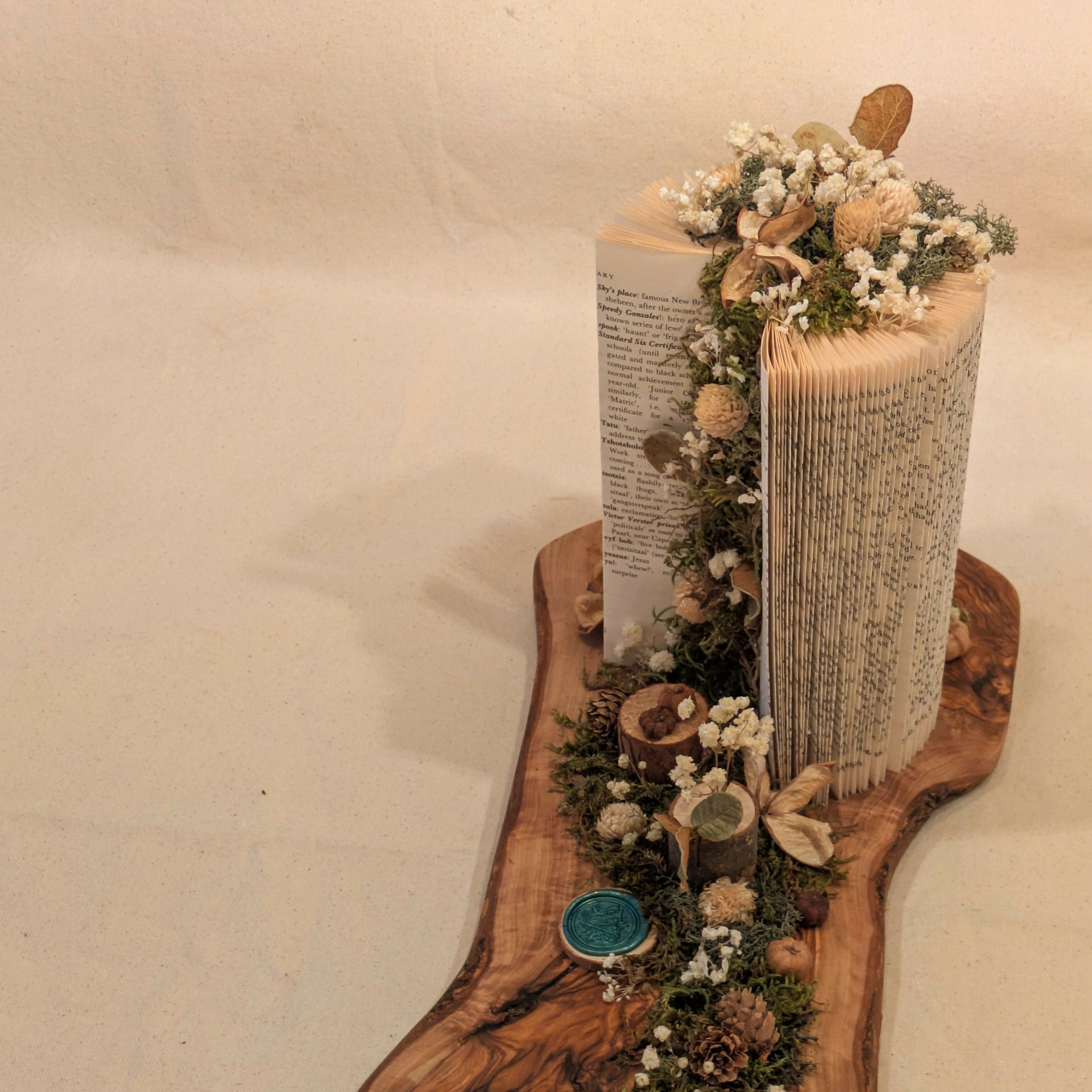 Warm Floral Arrangement on Wooden Slab