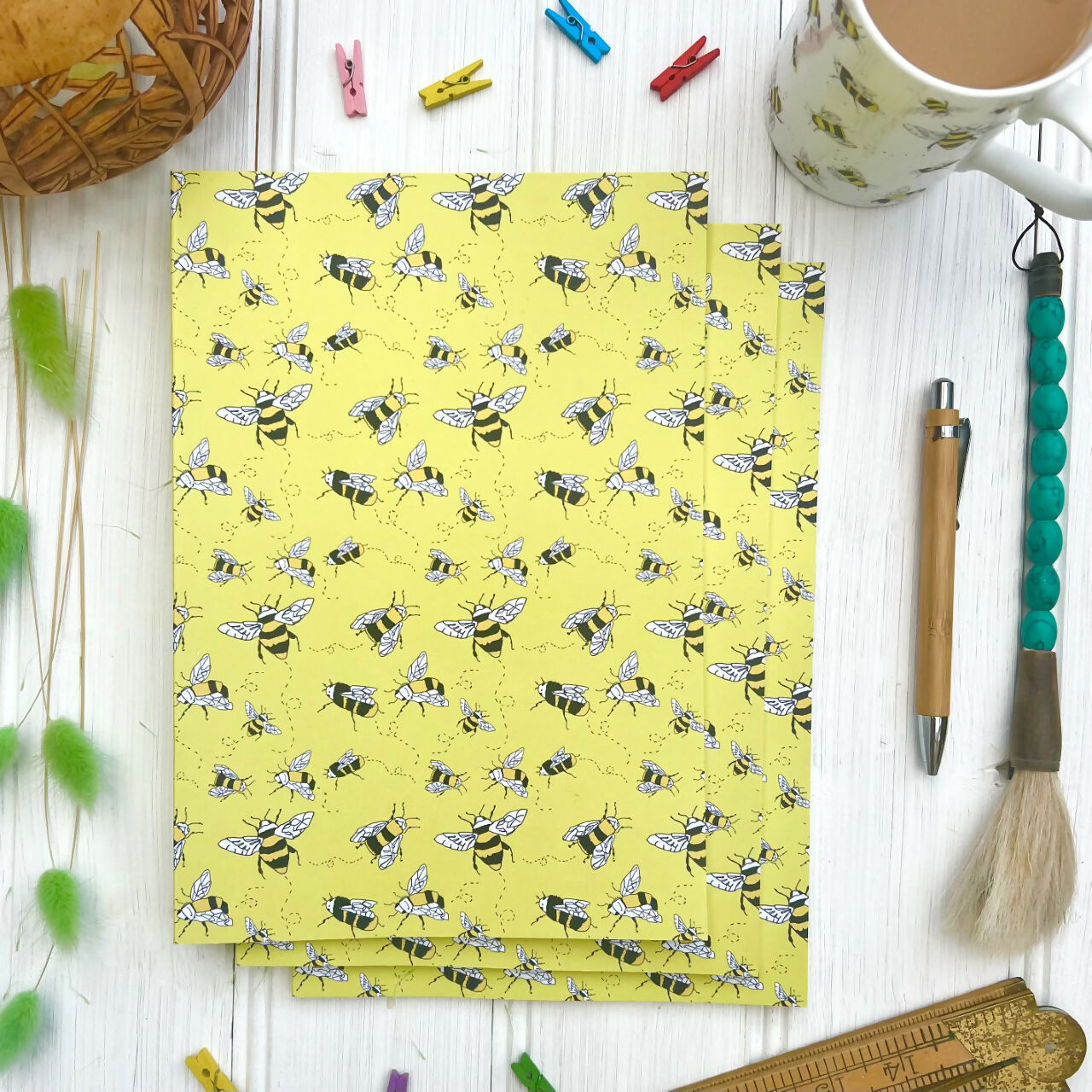 Yellow notebook with bee design.