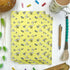 Yellow notebook with bee design.