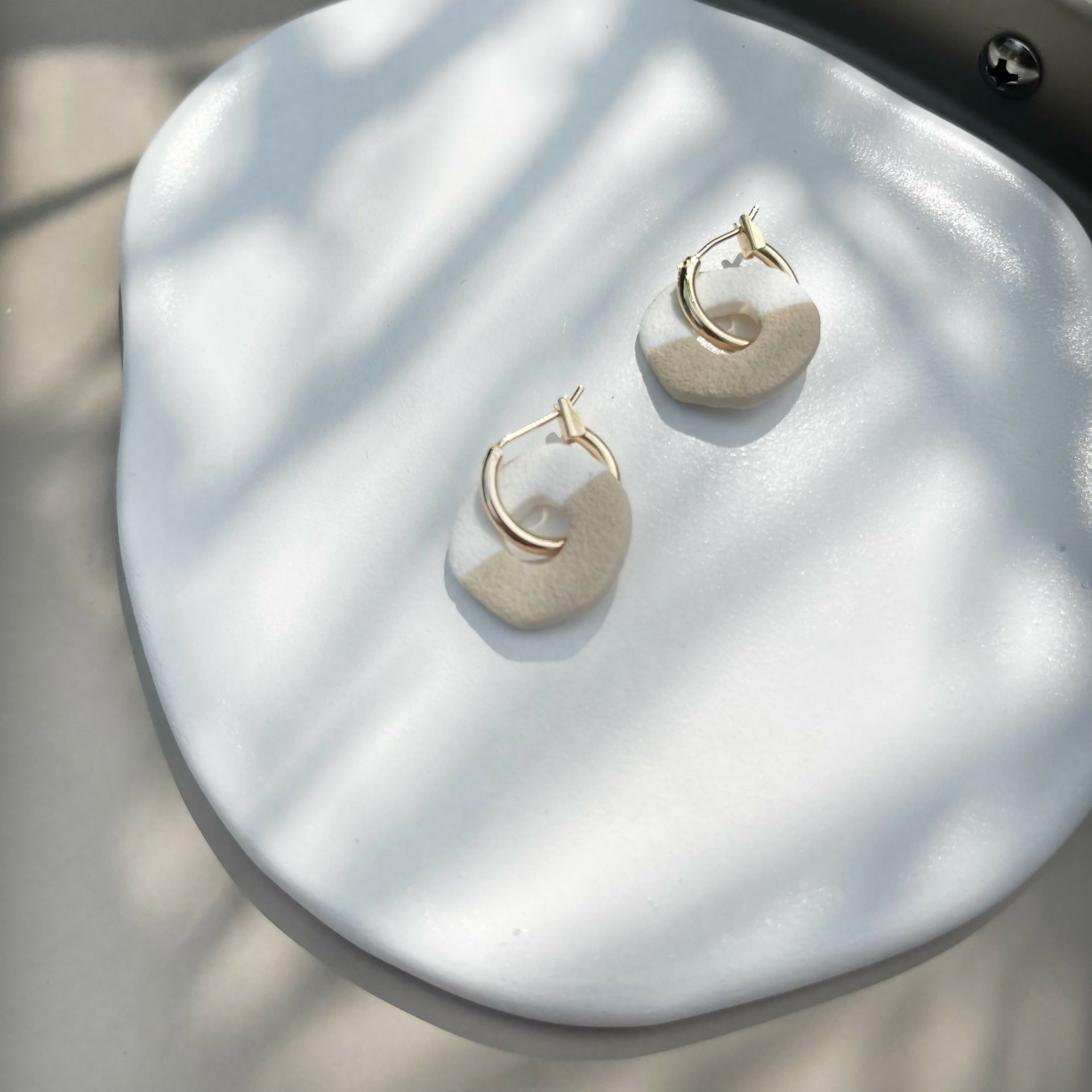 white and sand clay circle