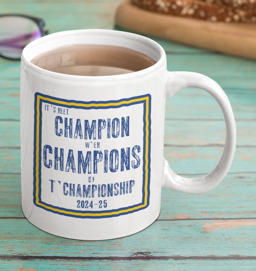 Leeds UTD white mug with blue and yellow 'champions' design.