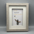 Pebble art picture with an orange and black scarf and the typography, 'EAT SLEEP HULL CITY REPEAT'.