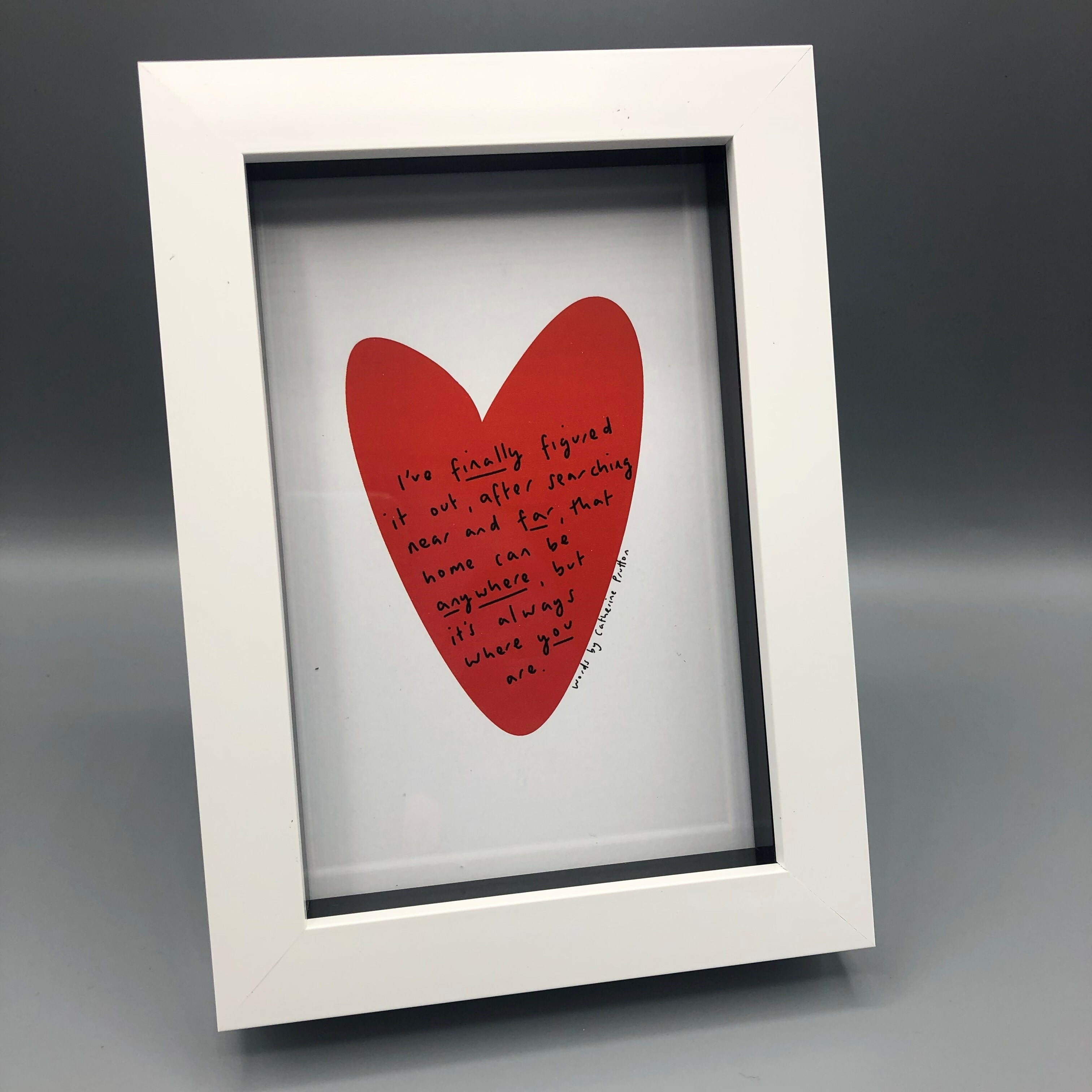 Poem in a red heart with white background and frame.