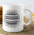 White mug with black barcode design.
