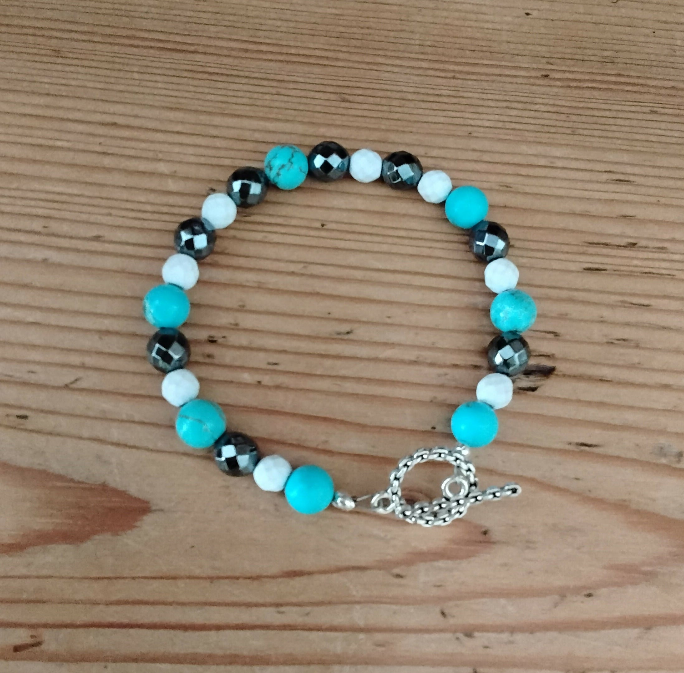 Tibetan Silver Toggle Catch Bracelet with Turquoise, Faceted White Howlite and Faceted Grey Hematite.