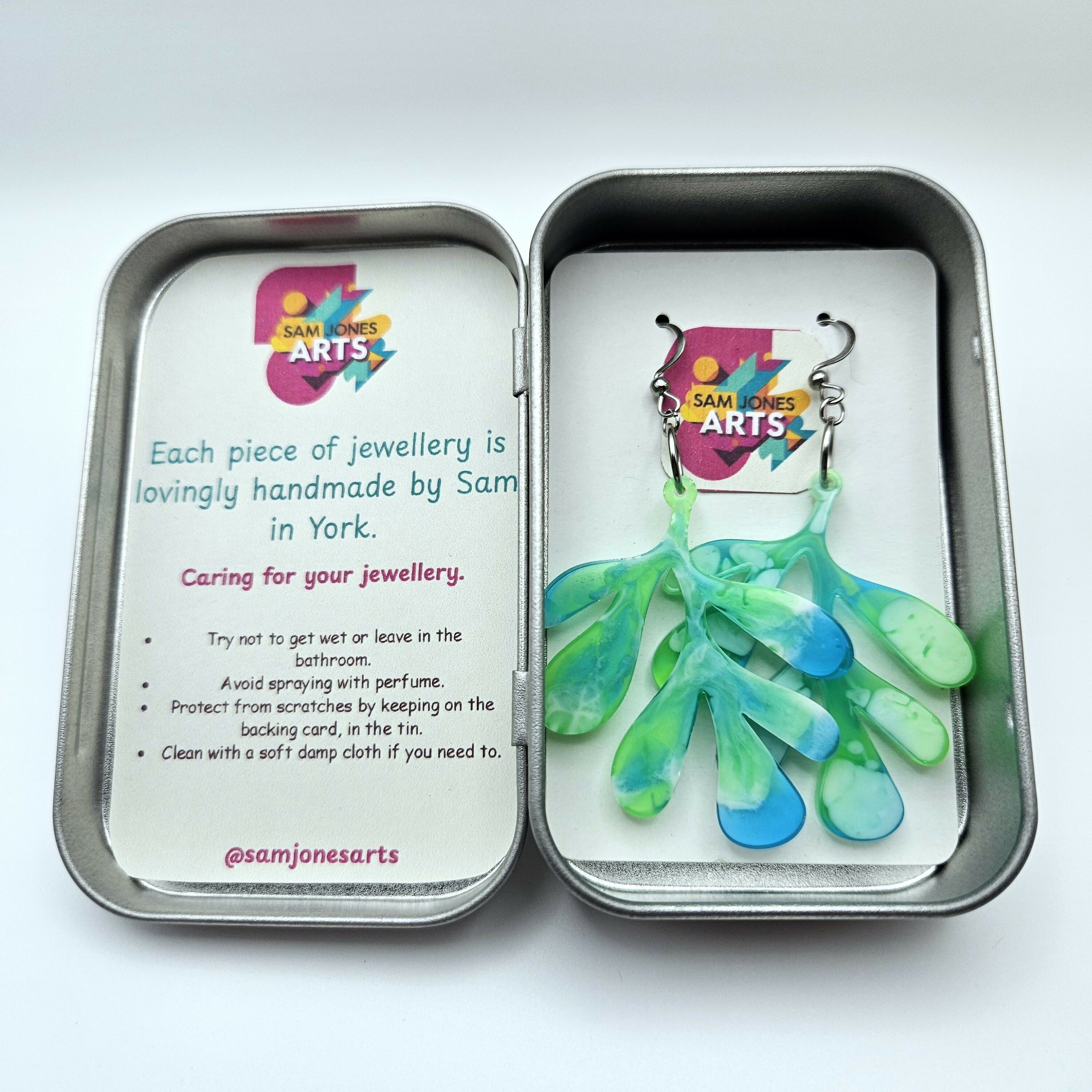 HANDMADE RESIN EARRINGS IN FUN, BOLD LEAF DESIGN.