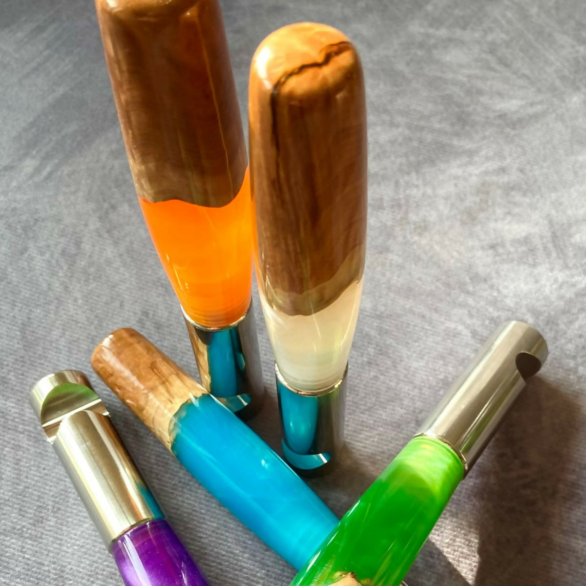 Wood and colourful resin bottle opener.