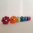 Colourful crochet triceratops.