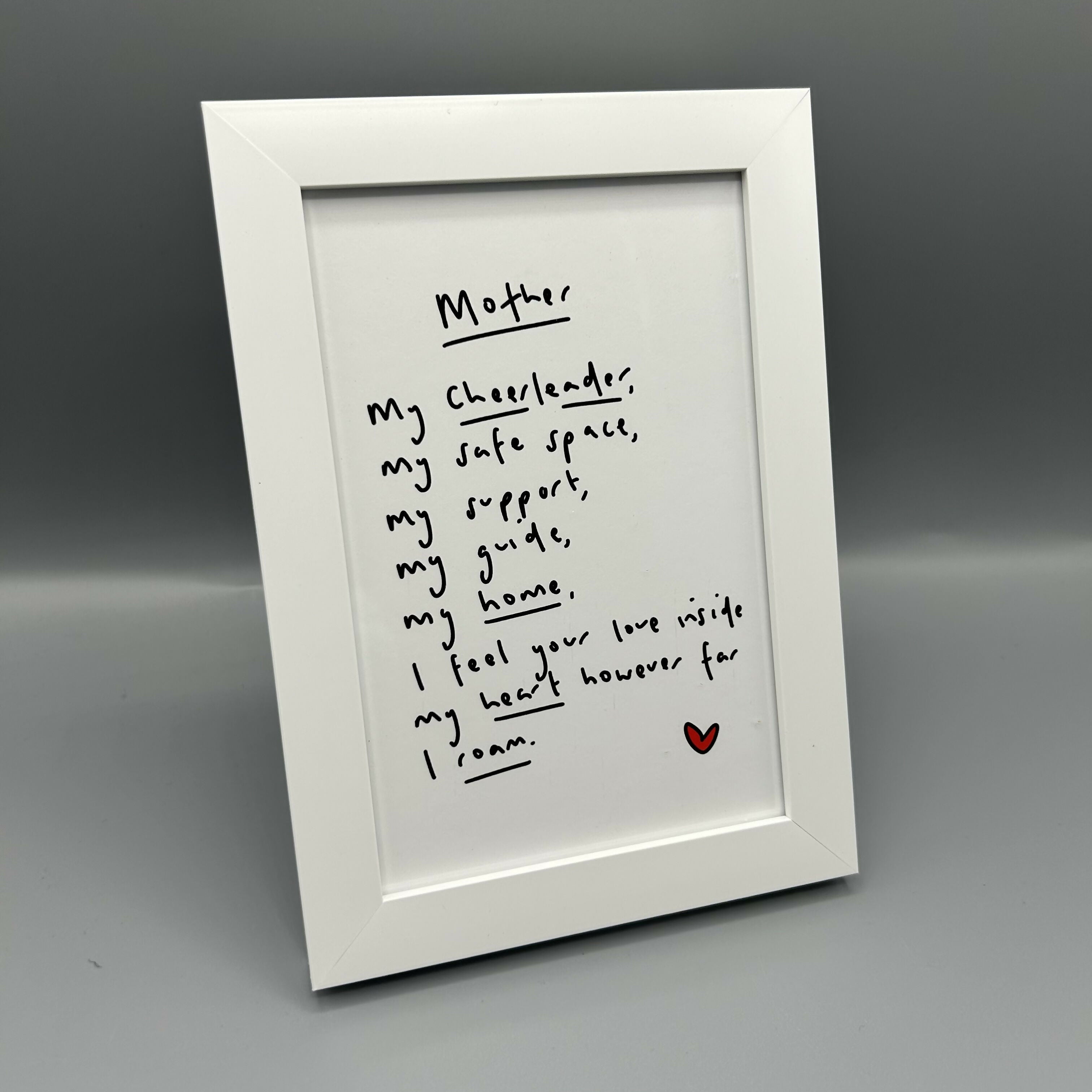Black and white poem with red heart.