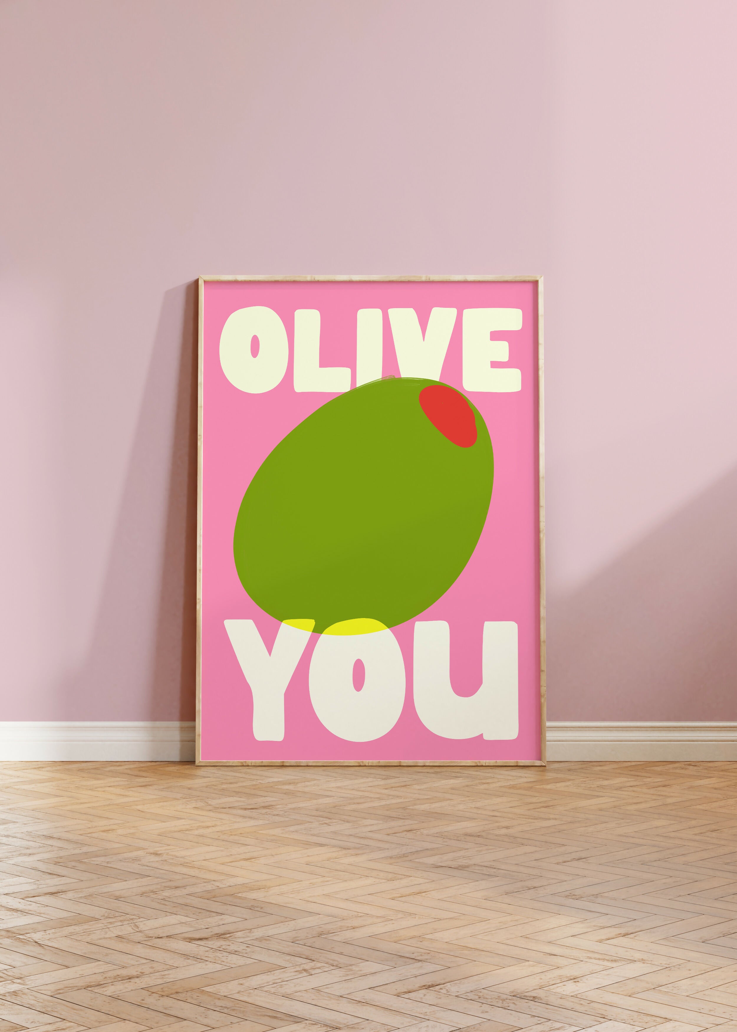 Pink, green and white print of an olive and the pun, 'OLIVE YOU'.