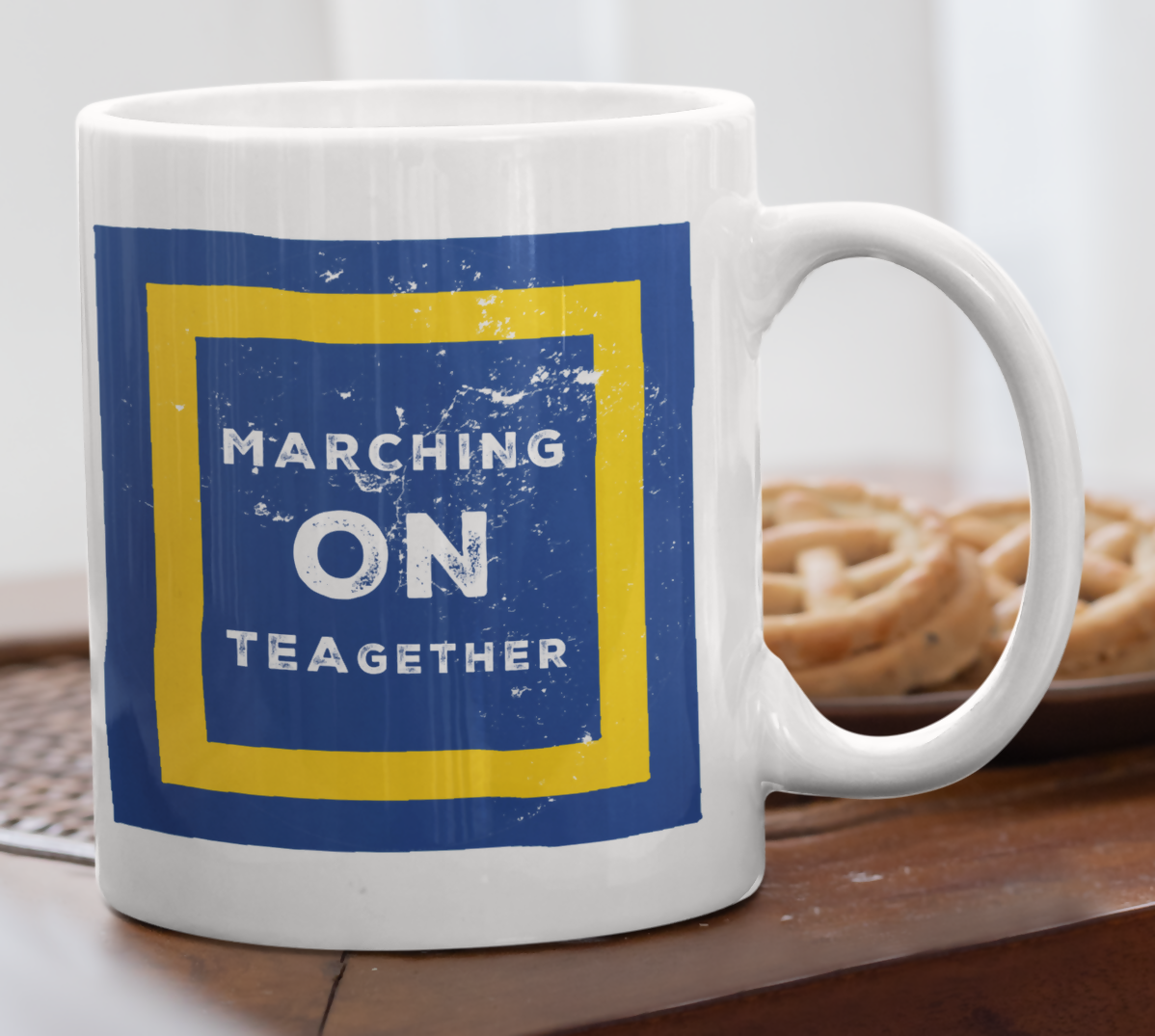 White mug with blue and yellow Leeds football club design.