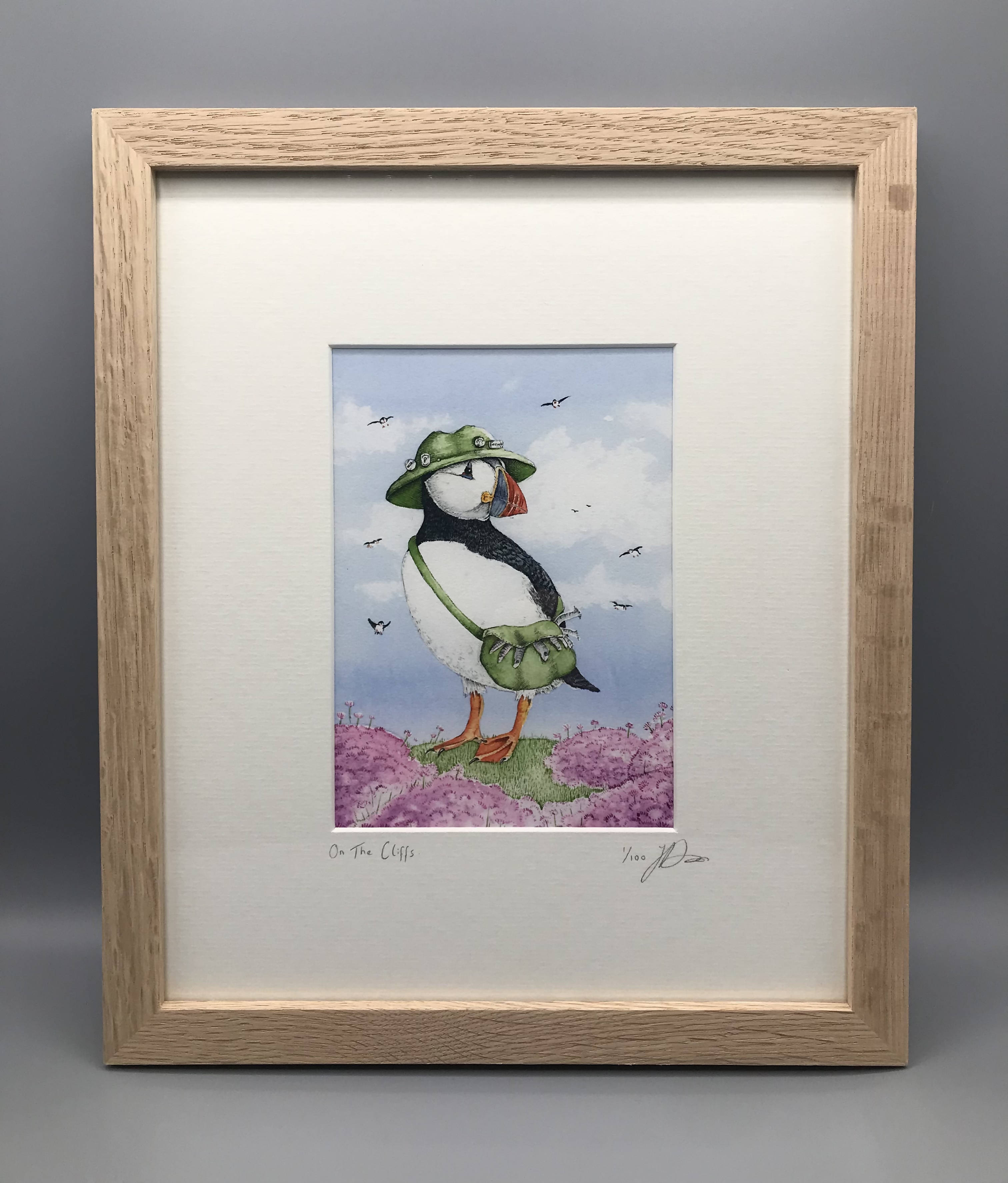 On The Cliffs - Limited Edition Giclee Print presented in a solid oak frame. By Jenny Davies