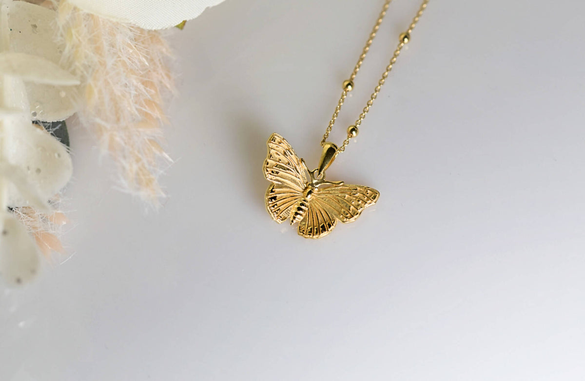 Solid gold hot sale butterfly pendant