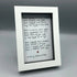 Black and white poem with red heart in a white frame.