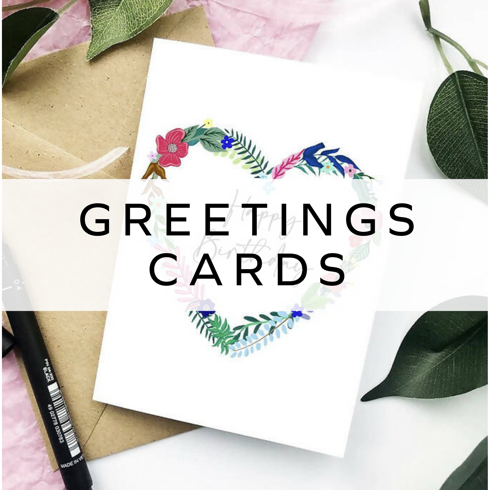 A pile of pink and gold cards with the text "love is all you need".