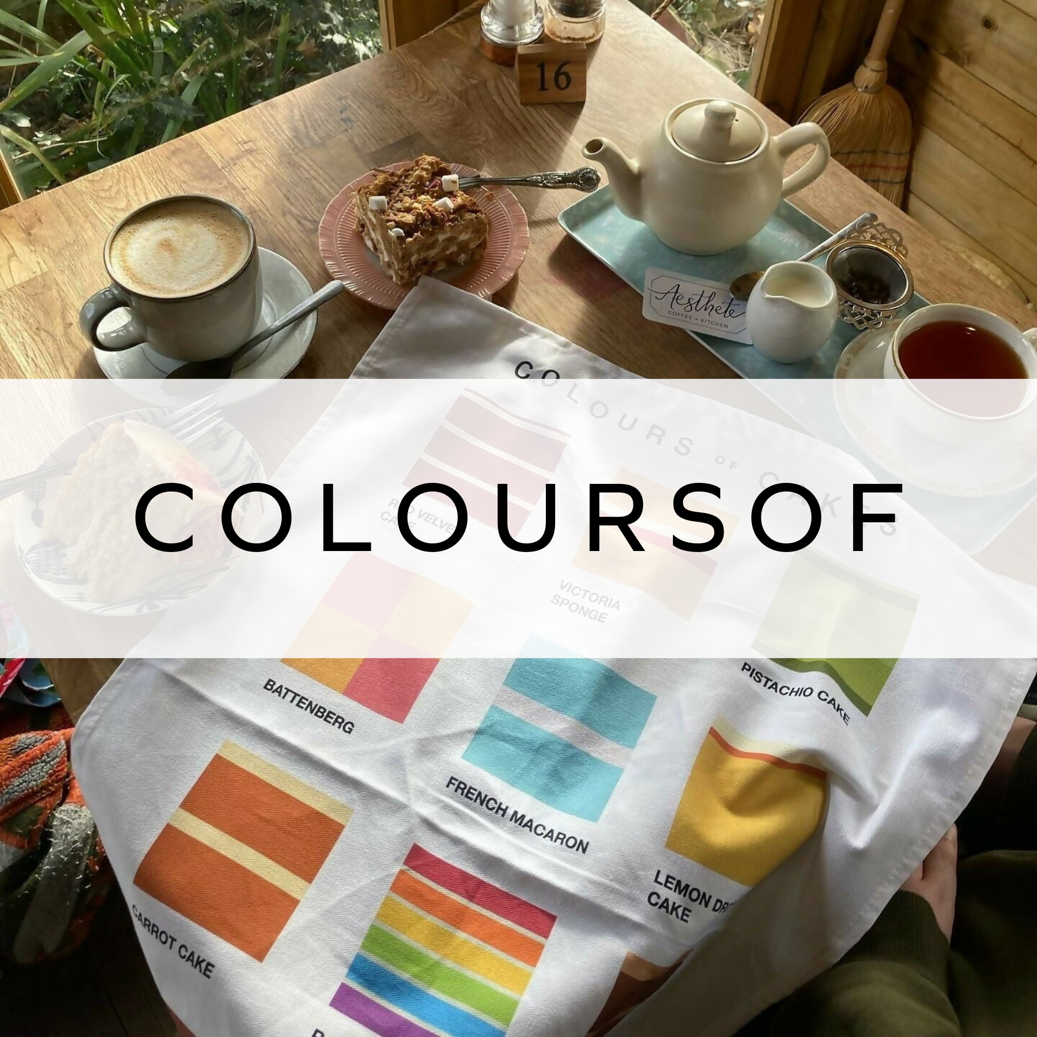A vibrant market stall adorned with a collection of colourful Pantone art prints, showcasing custom colour matches and unique designs in a lively display.