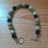 Tibetan Silver Toggle Catch Bracelet with Faceted Navy Goldstone and Yellow Turquoise.