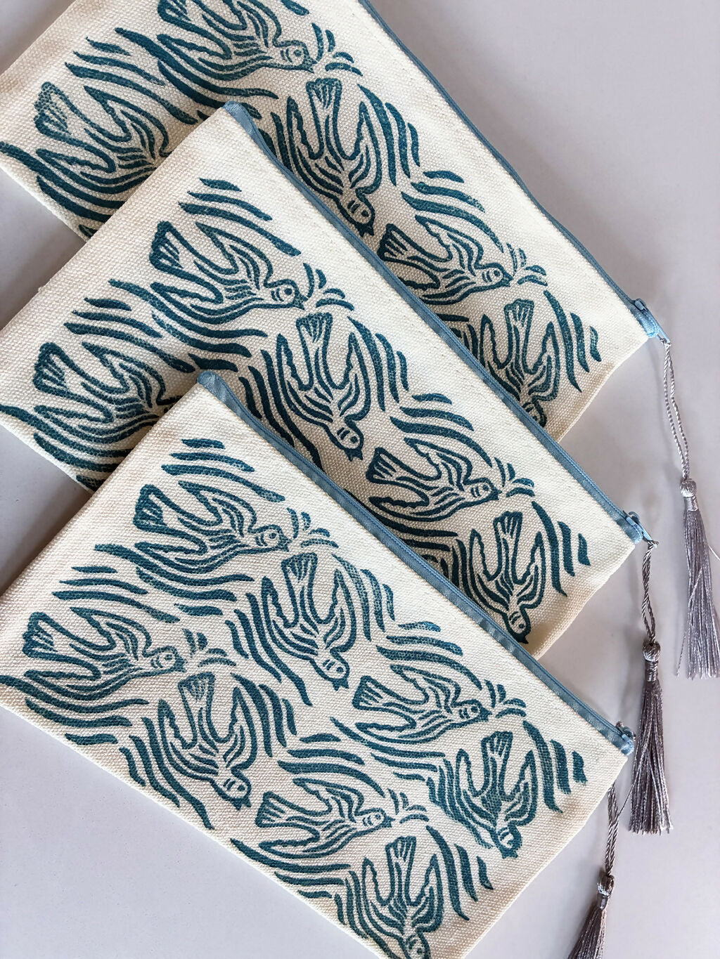 Hand printed Zip Pouch with Blue Flying Bird Design.