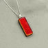Red Dichroic Fused Glass Pendant with Silver Plated Chain - Handmade by Jade Tapson Glass.