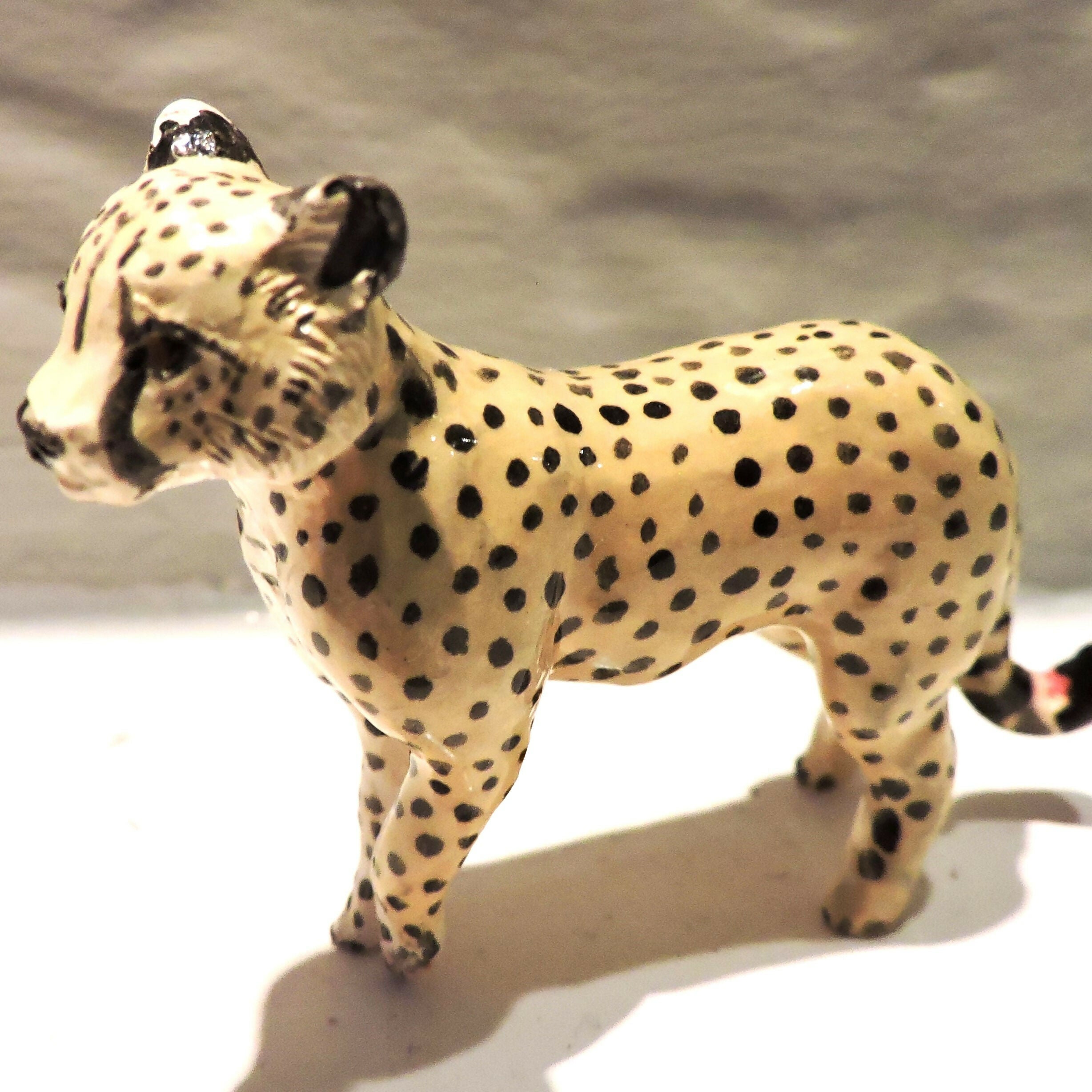Ceramic cheetah sculpture