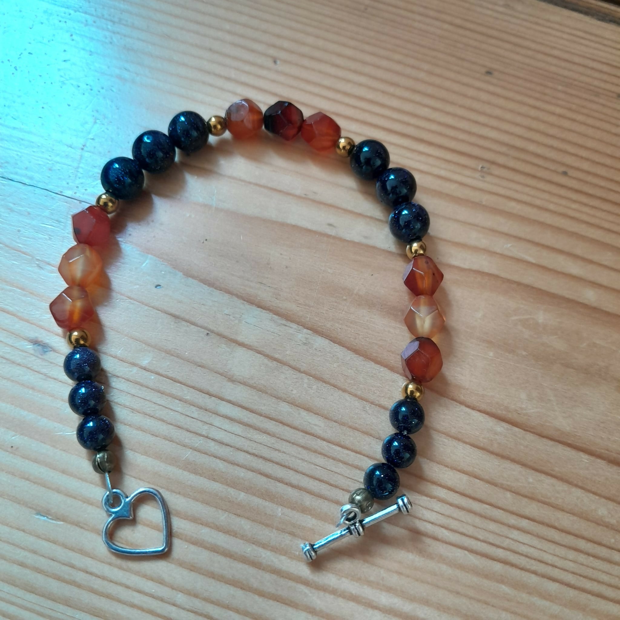 Tibetan Silver Toggle Bracelet with Navy Golstone, Bronze Hematite and Faceted Carnelian.