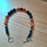 Tibetan Silver Toggle Bracelet with Navy Golstone, Bronze Hematite and Faceted Carnelian.