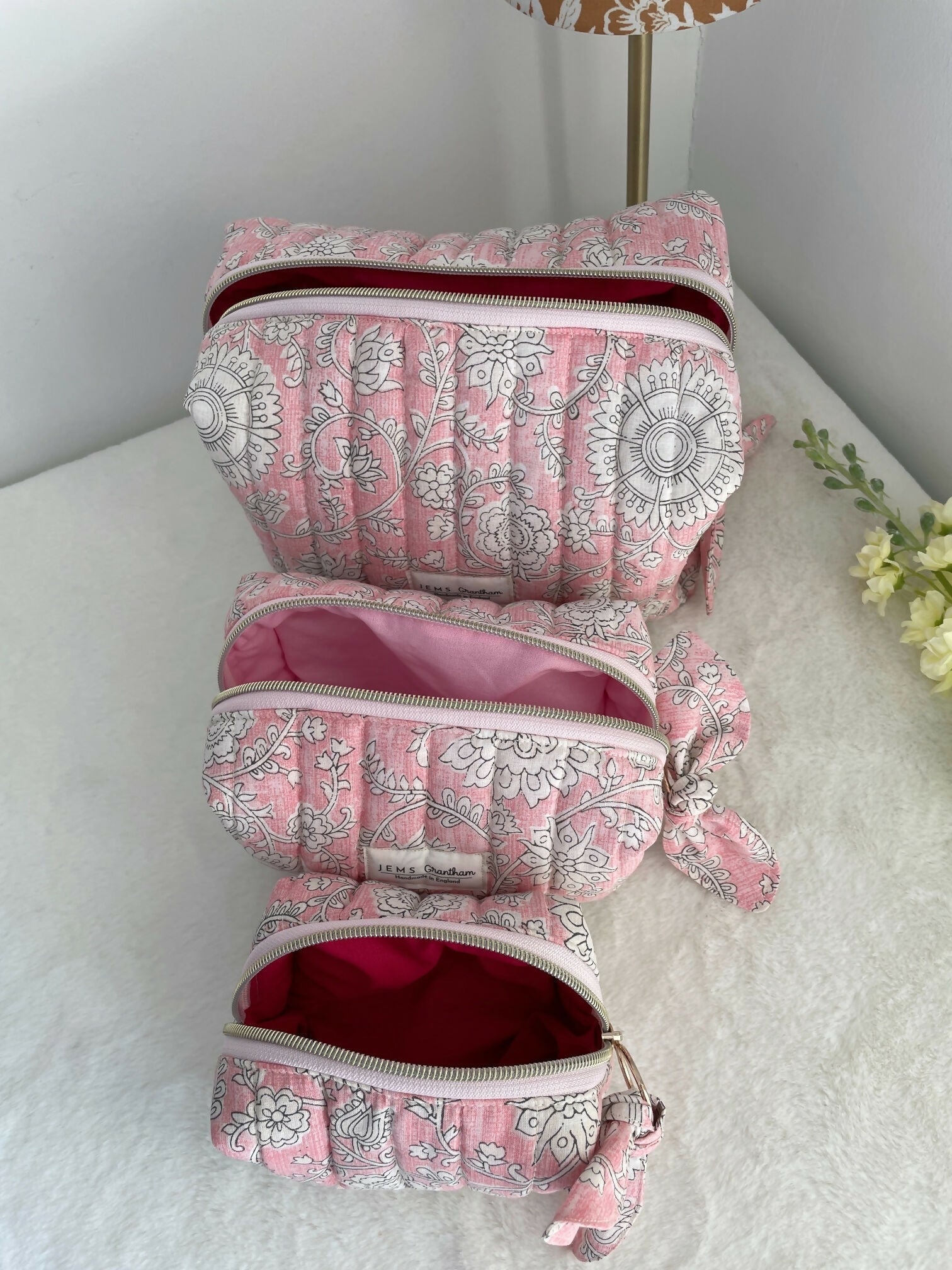 Pink Quilted Toiletry Bag with Zipper with white flower print