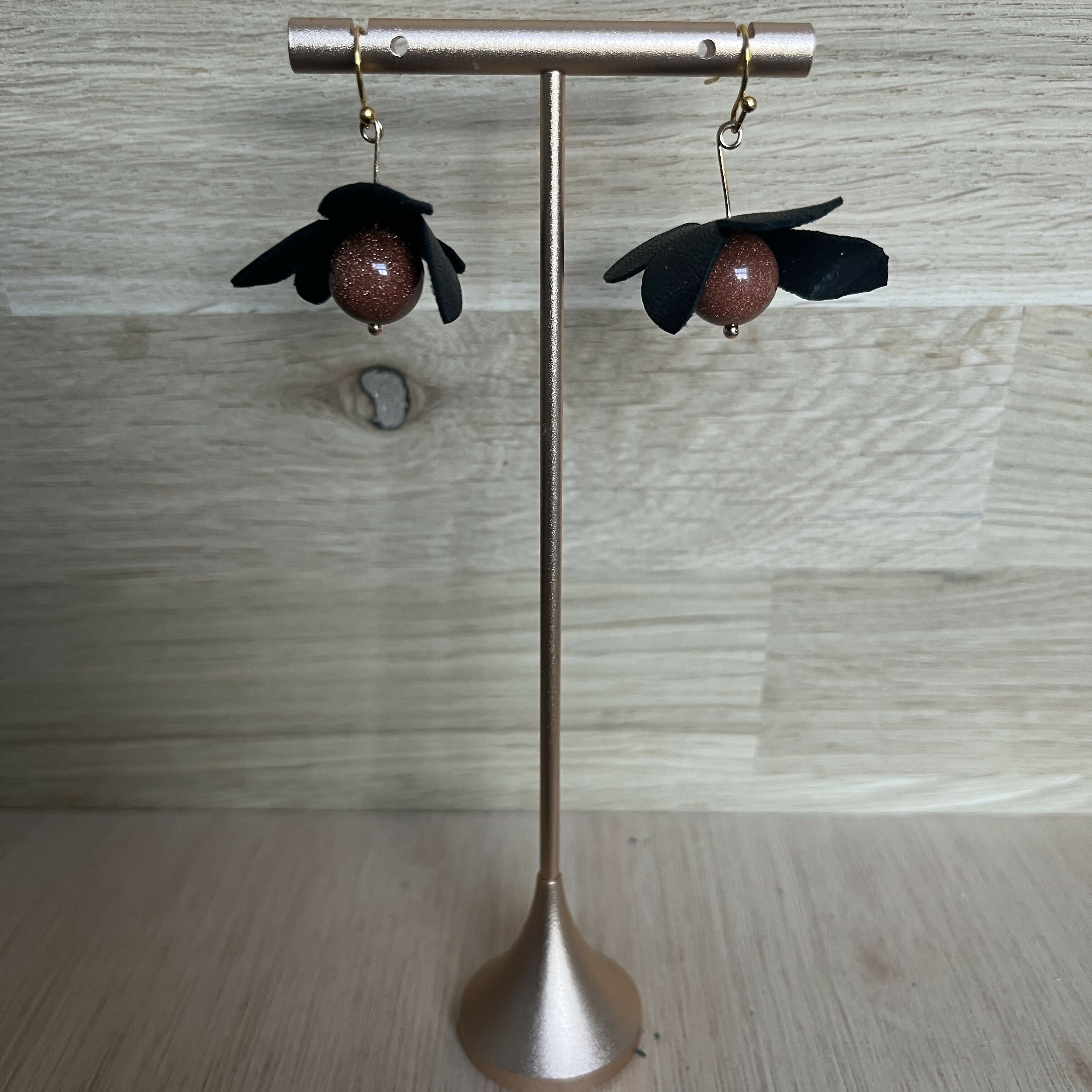 Forest Whisper – Black Leather Flower Earrings with Brown Stone