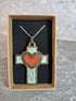 Handcrafted and engraved walnut veneered cross with a heart pendent.