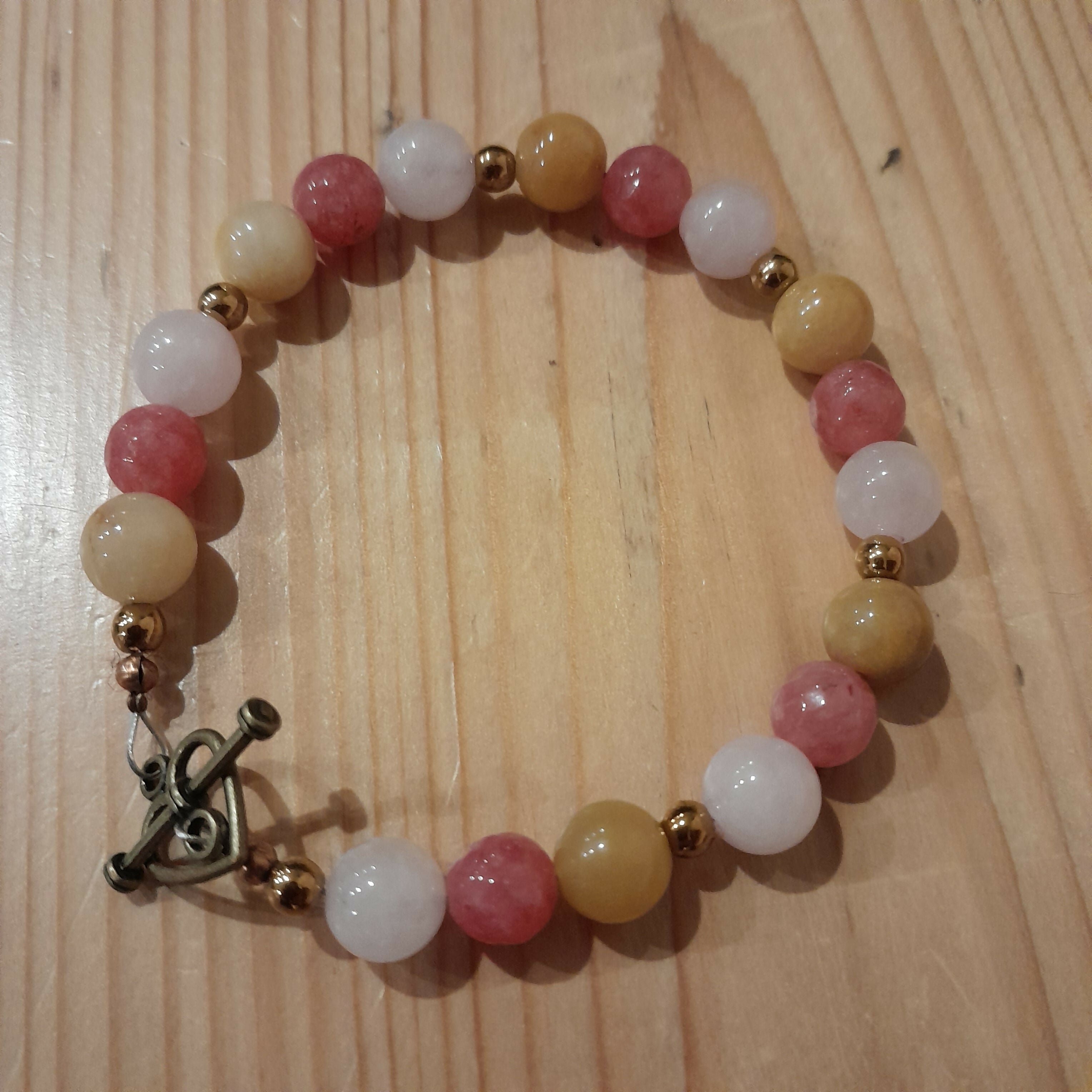 Bronze toggle Catch Bracelet with Yellow Jade, Strawberry Quartz, Rose Quartz and Bronze Hematite.
