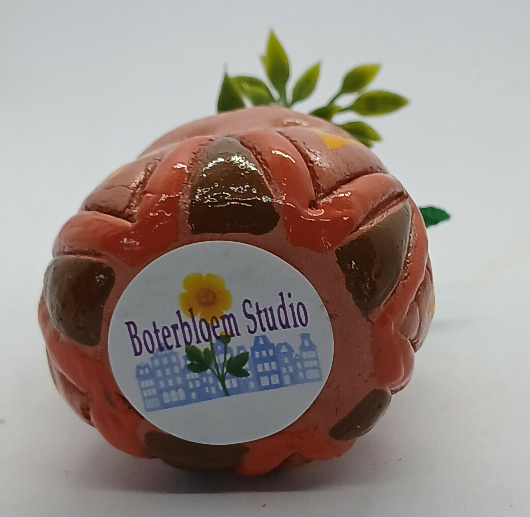 Small Clay Vase and Faux Flowers