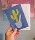 Blue card with cactus on.